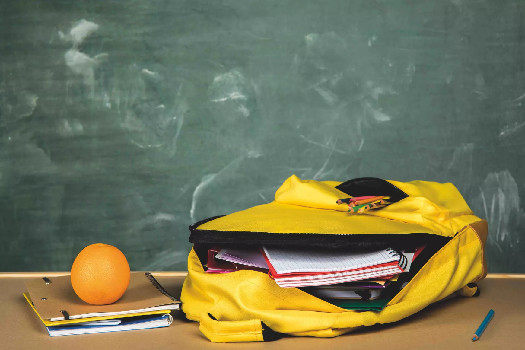 open-backpack-orange-table.jpeg